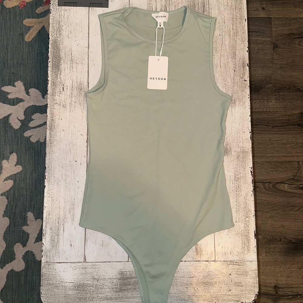 New with tags sage green bodysuit. Size small but runs a little big